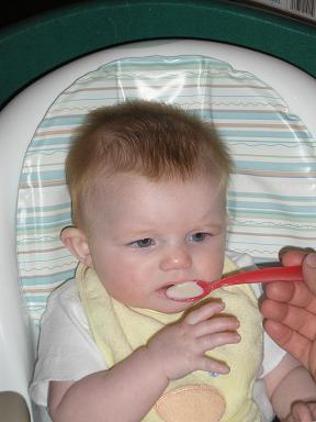 First attempt at solids and more went in her belly than on her shirt, but just by a tad bit.